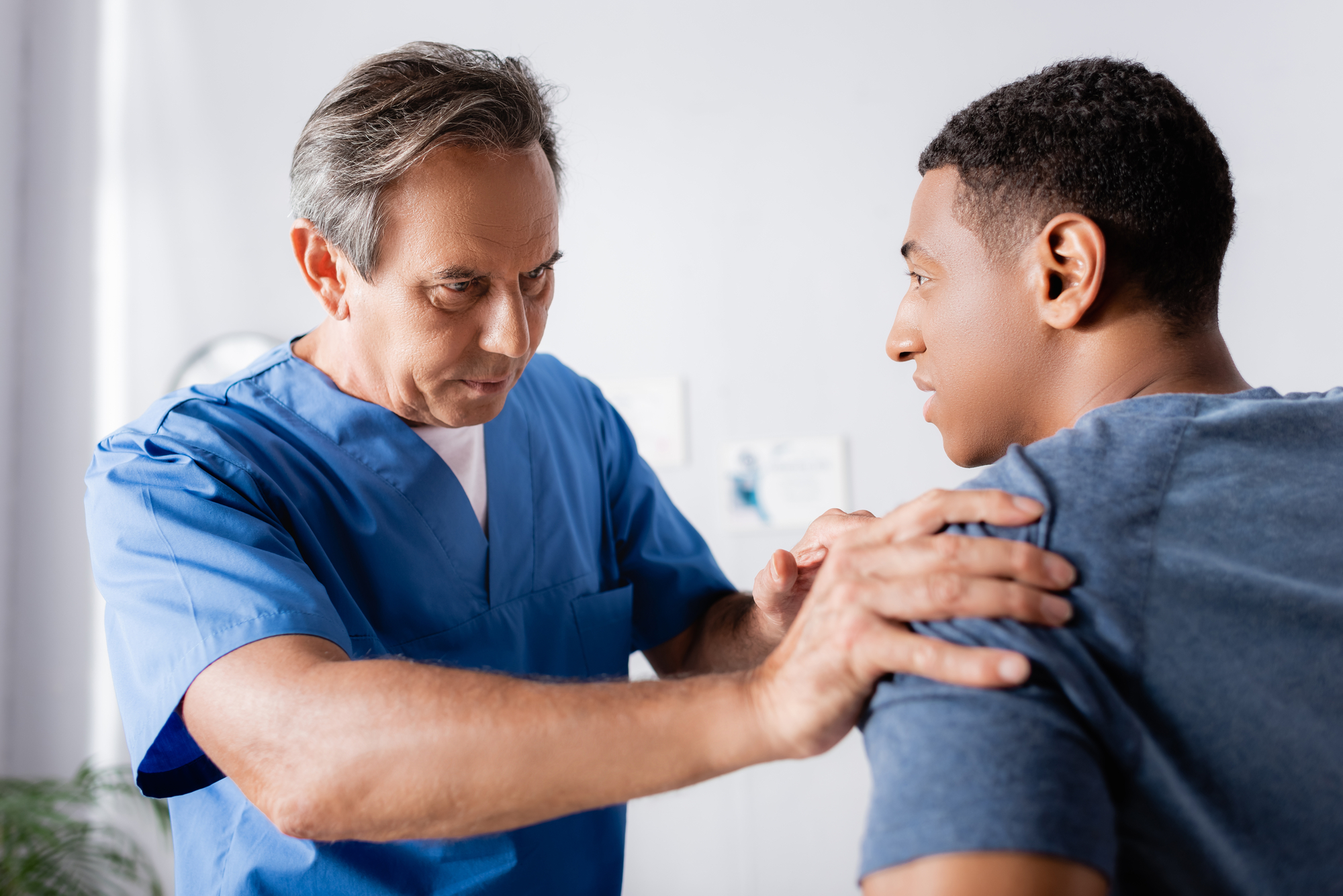 Dunkirk Workers Comp Lawyer - medical person examining male patient