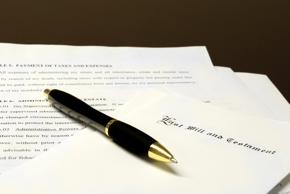 Common Estate Planning Questions - Pen laying on top of a Will for estate planning